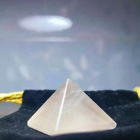 Polished rose quartz pyramid for meditation and home energy
