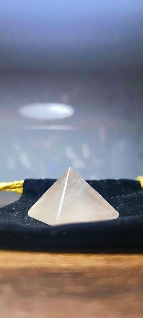 Polished rose quartz pyramid for meditation and home energy