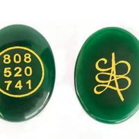 Zibu coin with engraved symbols for prosperity and abundance