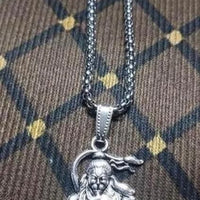 men's hanuman silver locket worn as spiritual accessory