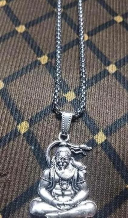 men's hanuman silver locket worn as spiritual accessory